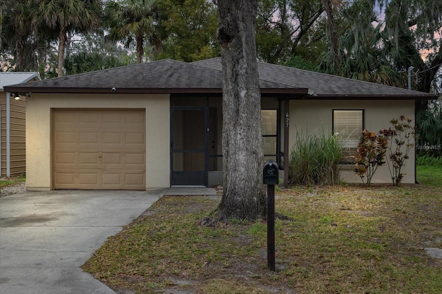 single story home featuring a garage