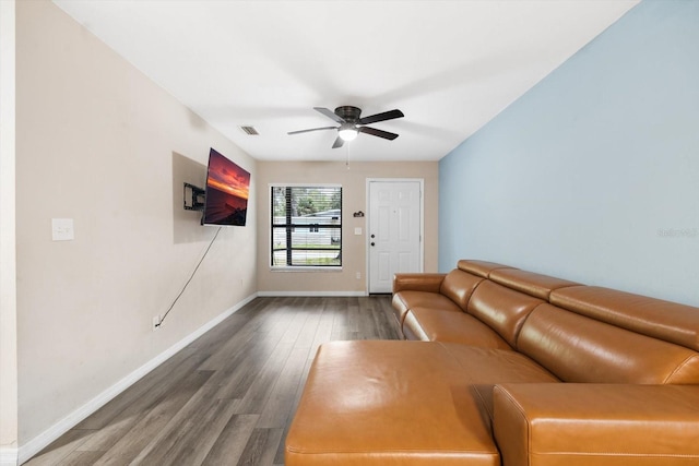 unfurnished living room featuring wood-type flooring and ceiling fan