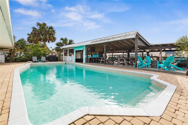 view of swimming pool featuring a patio area