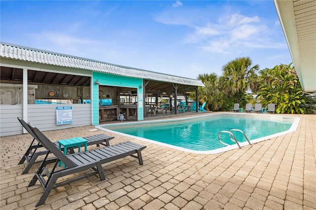 view of swimming pool featuring a patio