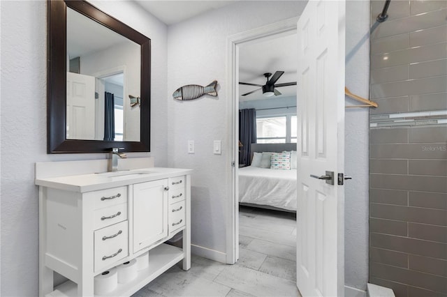 bathroom featuring ceiling fan and vanity