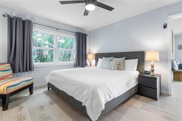 bedroom featuring ceiling fan and light hardwood / wood-style flooring