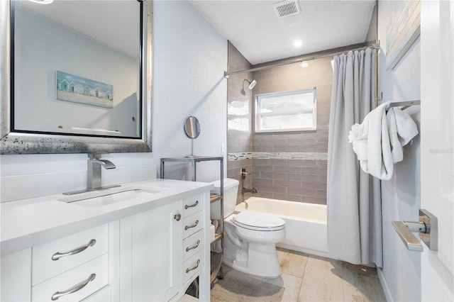 full bathroom featuring toilet, vanity, and shower / bath combo with shower curtain