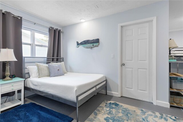 bedroom featuring a textured ceiling