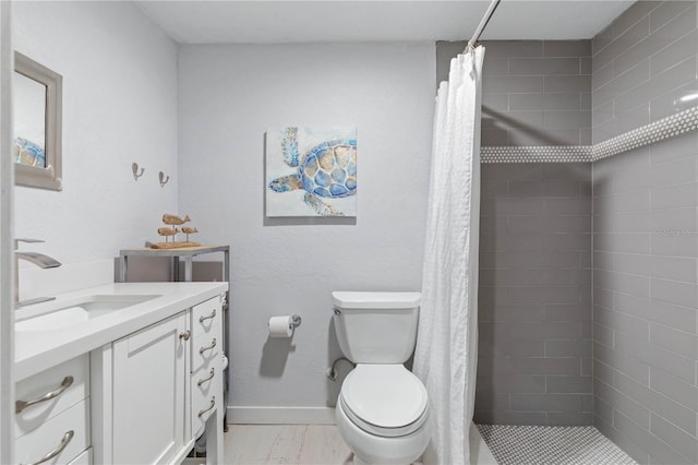 bathroom with curtained shower, toilet, and vanity