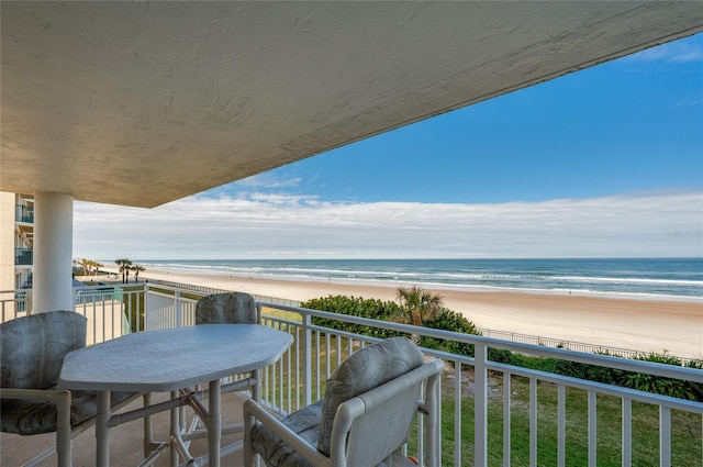 balcony with a view of the beach and a water view