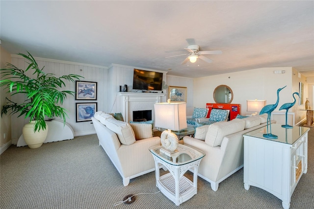 carpeted living room with ceiling fan