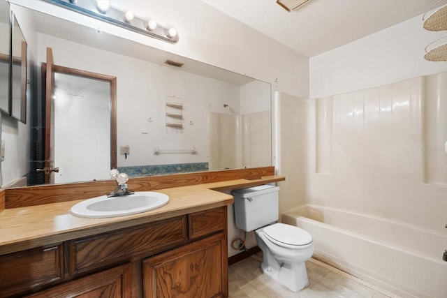 full bathroom featuring a textured ceiling, toilet, washtub / shower combination, and vanity