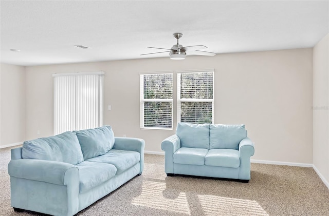 living room with ceiling fan and light carpet