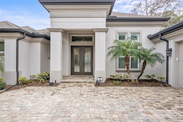 property entrance featuring french doors