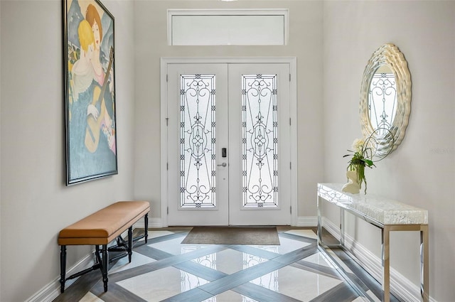 entryway featuring french doors, a healthy amount of sunlight, and light tile patterned floors