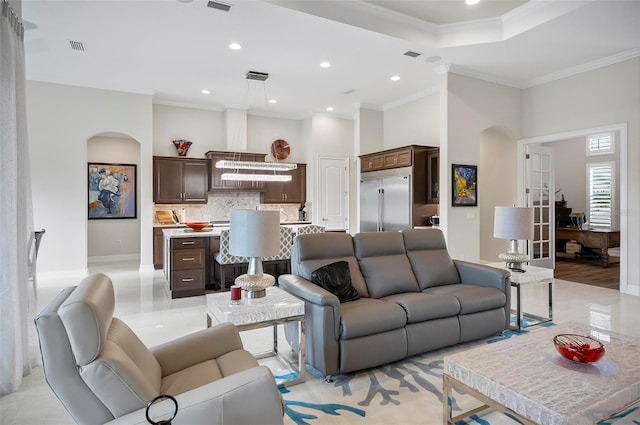 living room featuring crown molding