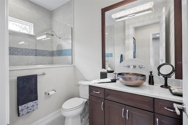 bathroom featuring vanity, toilet, a notable chandelier, and walk in shower