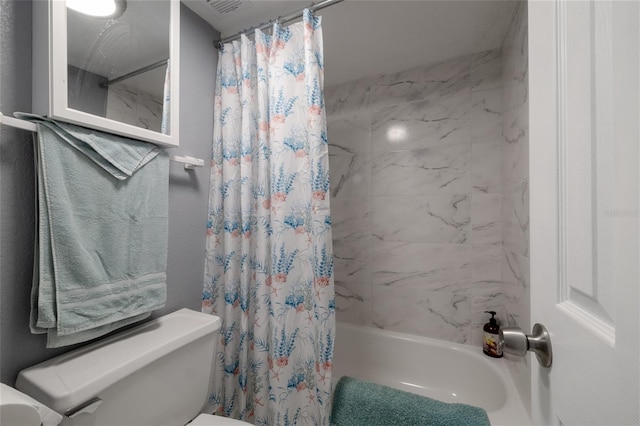 bathroom with toilet and shower / bath combo