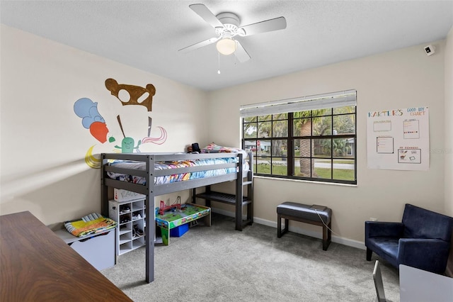 bedroom with ceiling fan and light colored carpet