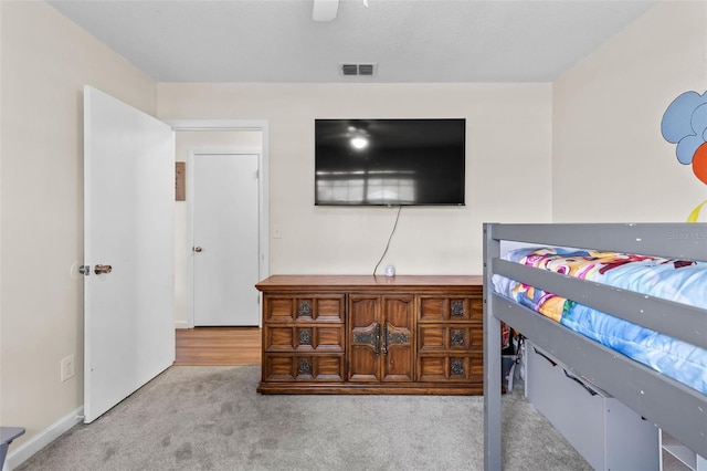 carpeted bedroom with ceiling fan