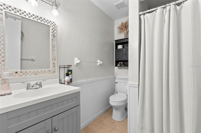 bathroom with tile patterned flooring, toilet, a shower with shower curtain, vanity, and a textured ceiling