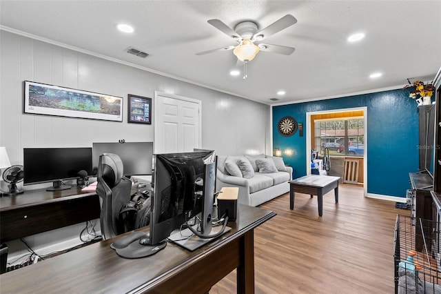 office with ornamental molding, ceiling fan, and hardwood / wood-style flooring