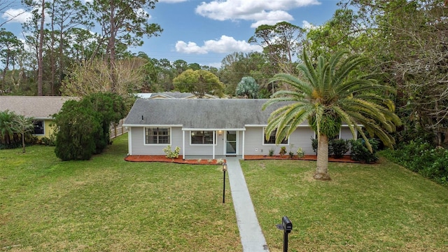 single story home with a front yard