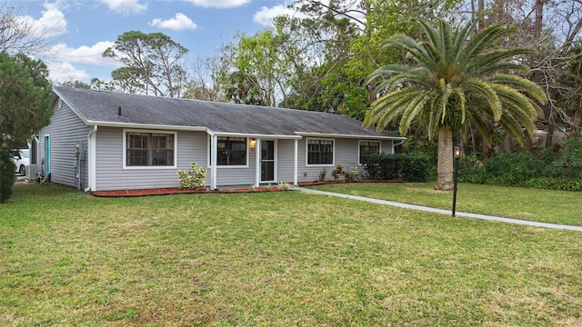 single story home featuring a front lawn