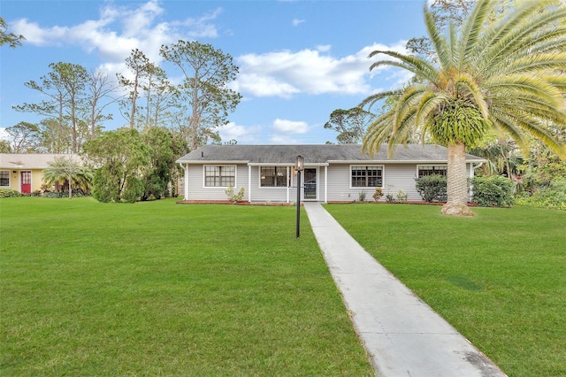 ranch-style home with a front lawn