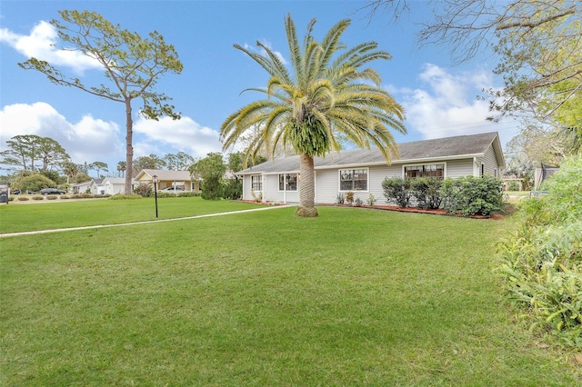 view of front of home with a front lawn