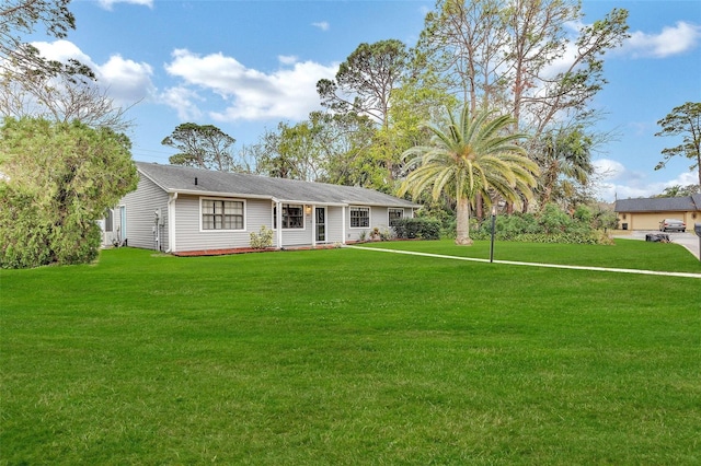 single story home with a front lawn