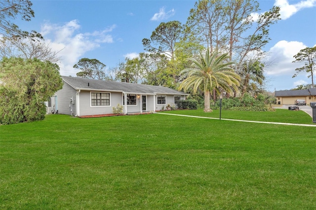 ranch-style home featuring a front yard