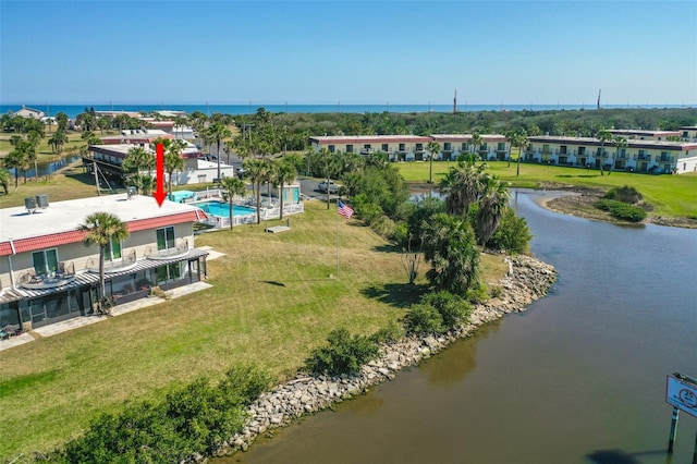 birds eye view of property with a water view