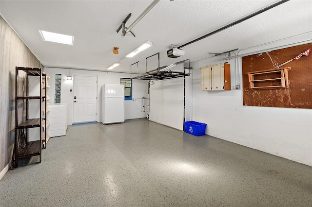 garage with white refrigerator and a garage door opener