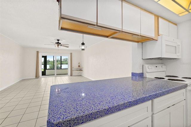 kitchen with white cabinetry, white appliances, light tile patterned flooring, and pendant lighting