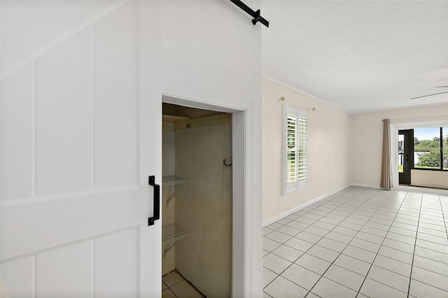 bathroom with tile patterned floors and a textured ceiling