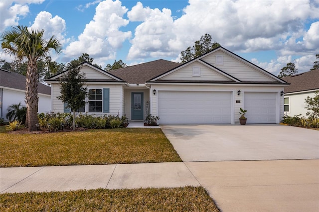 ranch-style home with a front lawn and a garage