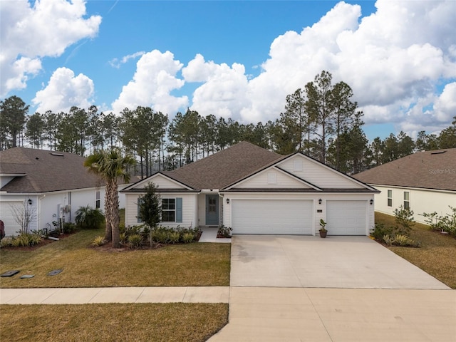 ranch-style home with a garage and a front lawn