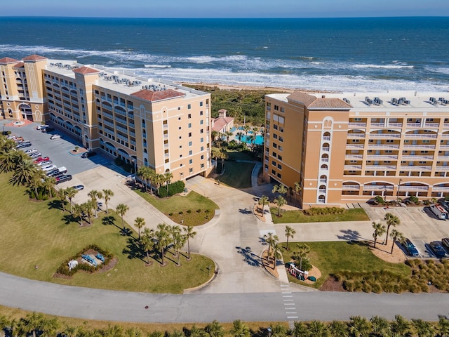 aerial view with a water view and a view of the beach