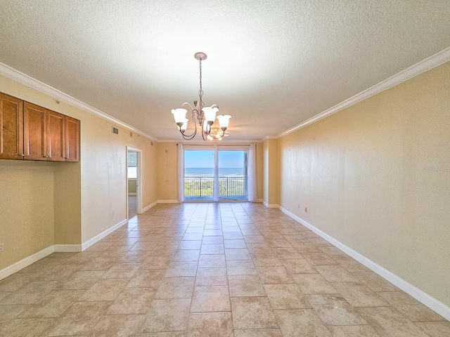 unfurnished dining area featuring ornamental molding and a notable chandelier