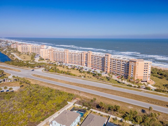 aerial view featuring a water view and a beach view