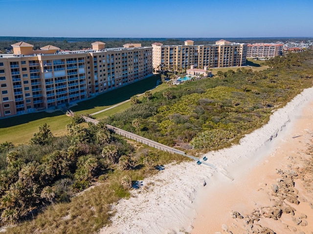 bird's eye view with a beach view and a water view