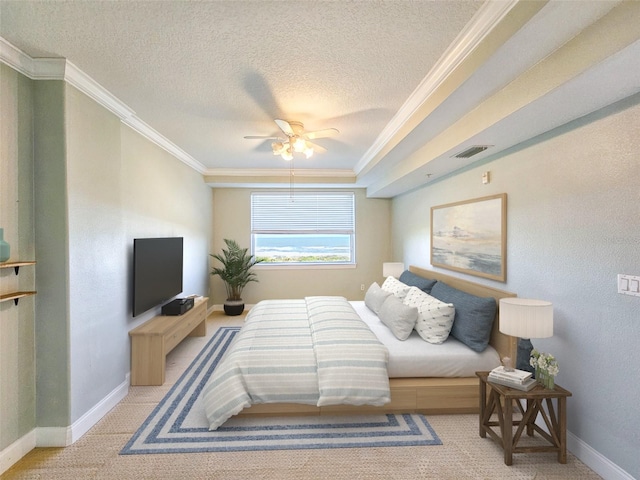 bedroom featuring ceiling fan, ornamental molding, light carpet, and a textured ceiling