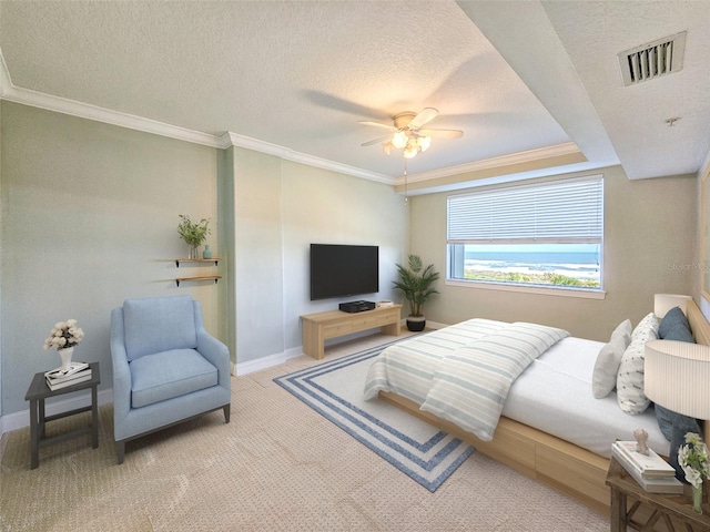 carpeted bedroom featuring crown molding, ceiling fan, and a textured ceiling