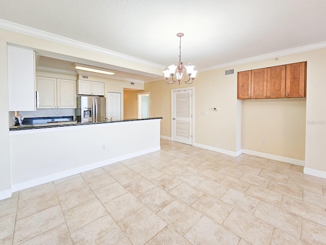 kitchen with ornamental molding, a chandelier, stainless steel fridge with ice dispenser, and hanging light fixtures