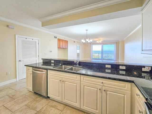 kitchen featuring sink, dishwasher, dark stone countertops, an inviting chandelier, and ornamental molding