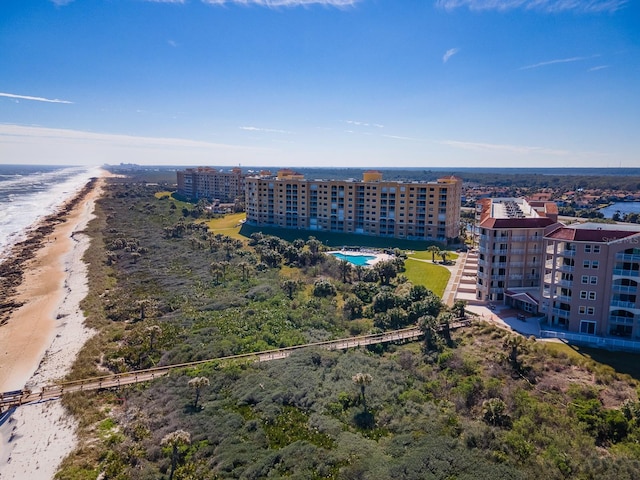 aerial view featuring a water view and a beach view