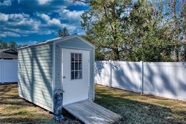 view of outbuilding with a lawn