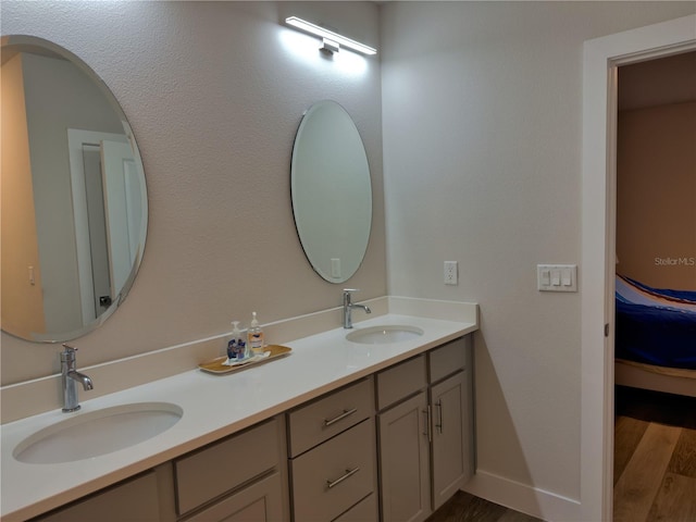 bathroom with vanity and hardwood / wood-style floors