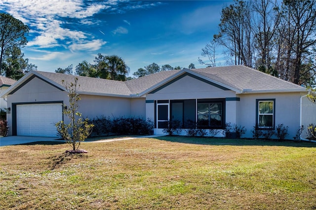 ranch-style home featuring a garage and a front yard