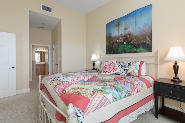 carpeted bedroom with connected bathroom