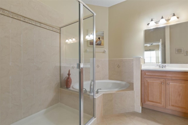 bathroom with tile patterned flooring, vanity, and separate shower and tub