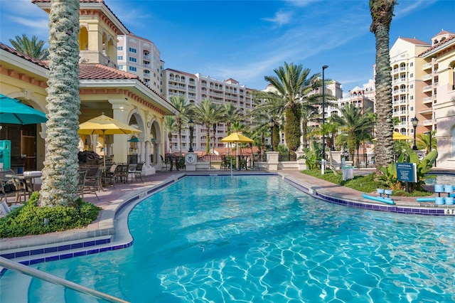 view of swimming pool featuring a patio area