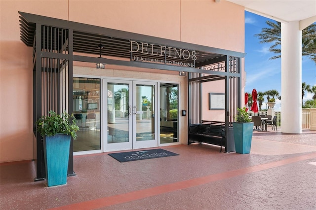 view of exterior entry featuring french doors